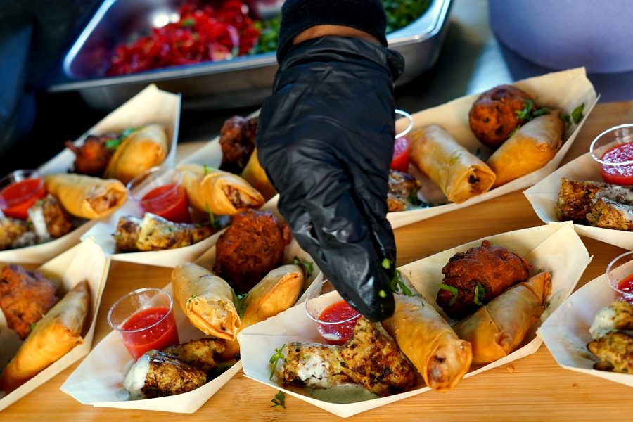 Canape boards being plated at a corporate catering event in Leicestershire