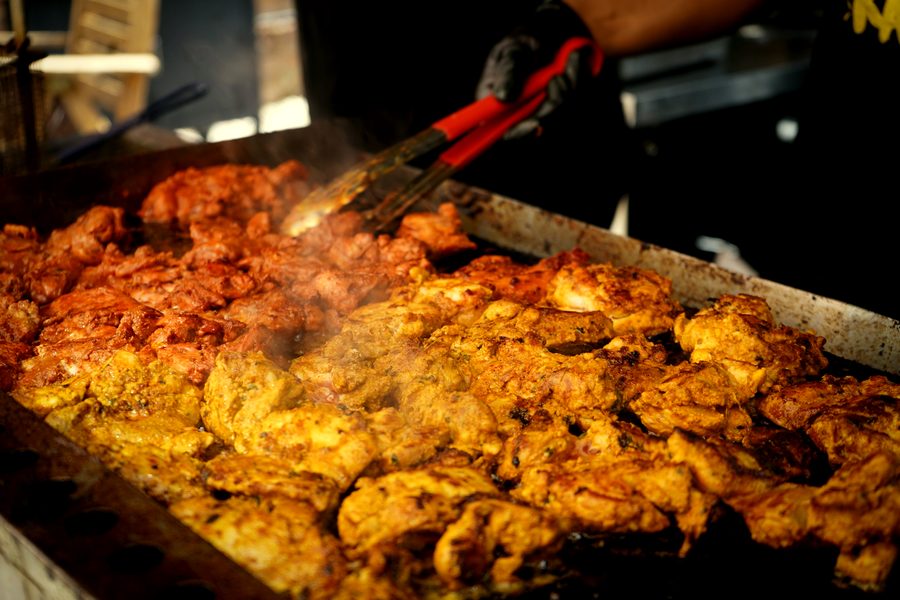 Tandoori chicken cooking on the grill at a wedding in Leicestershire